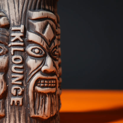 ceramic tribal tiki mug with carved faces