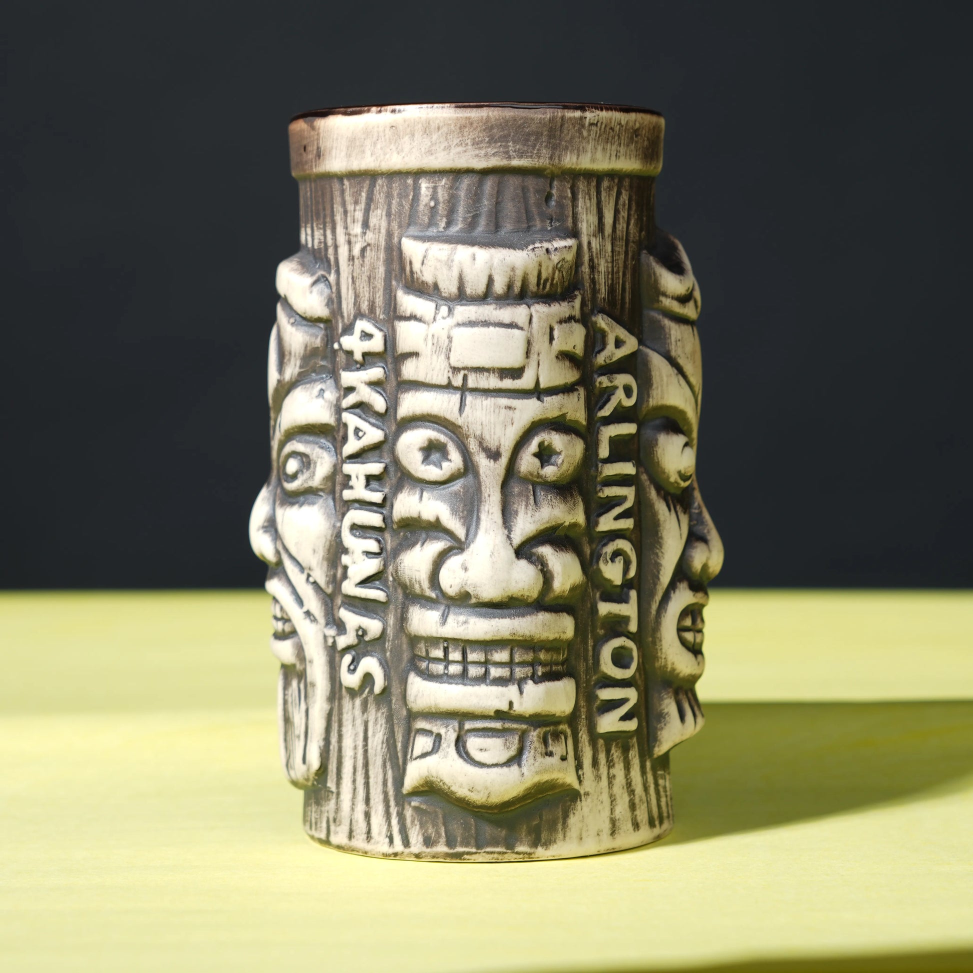 ceramic tribal tiki mug with carved faces