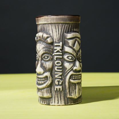 ceramic tribal tiki mug with carved faces
