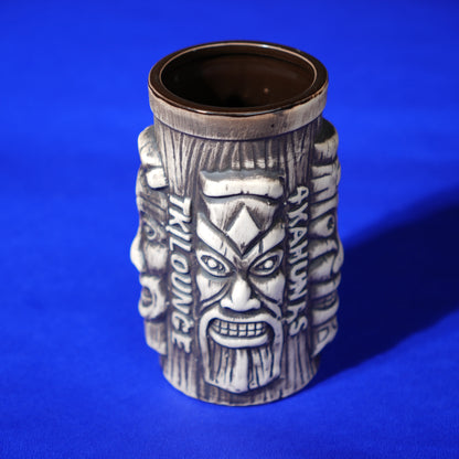 ceramic tribal tiki mug with carved faces