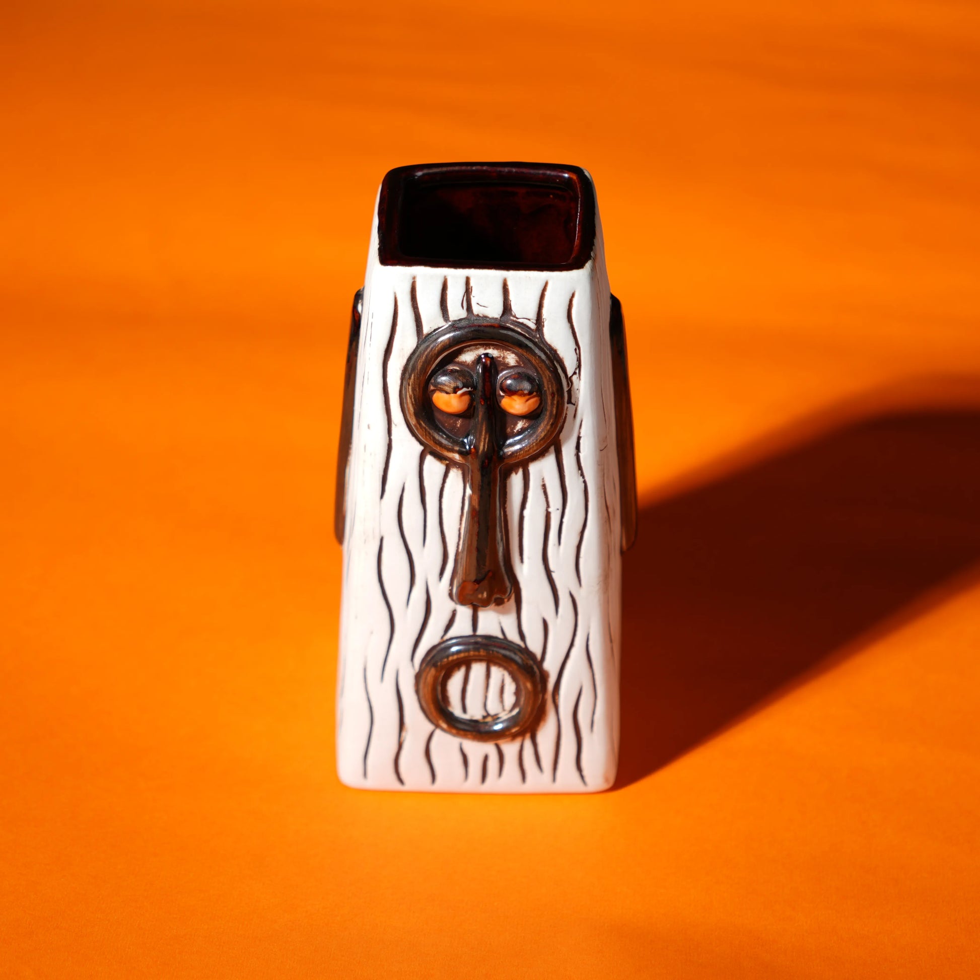 ceramic totem tiki mug with carved tribal face