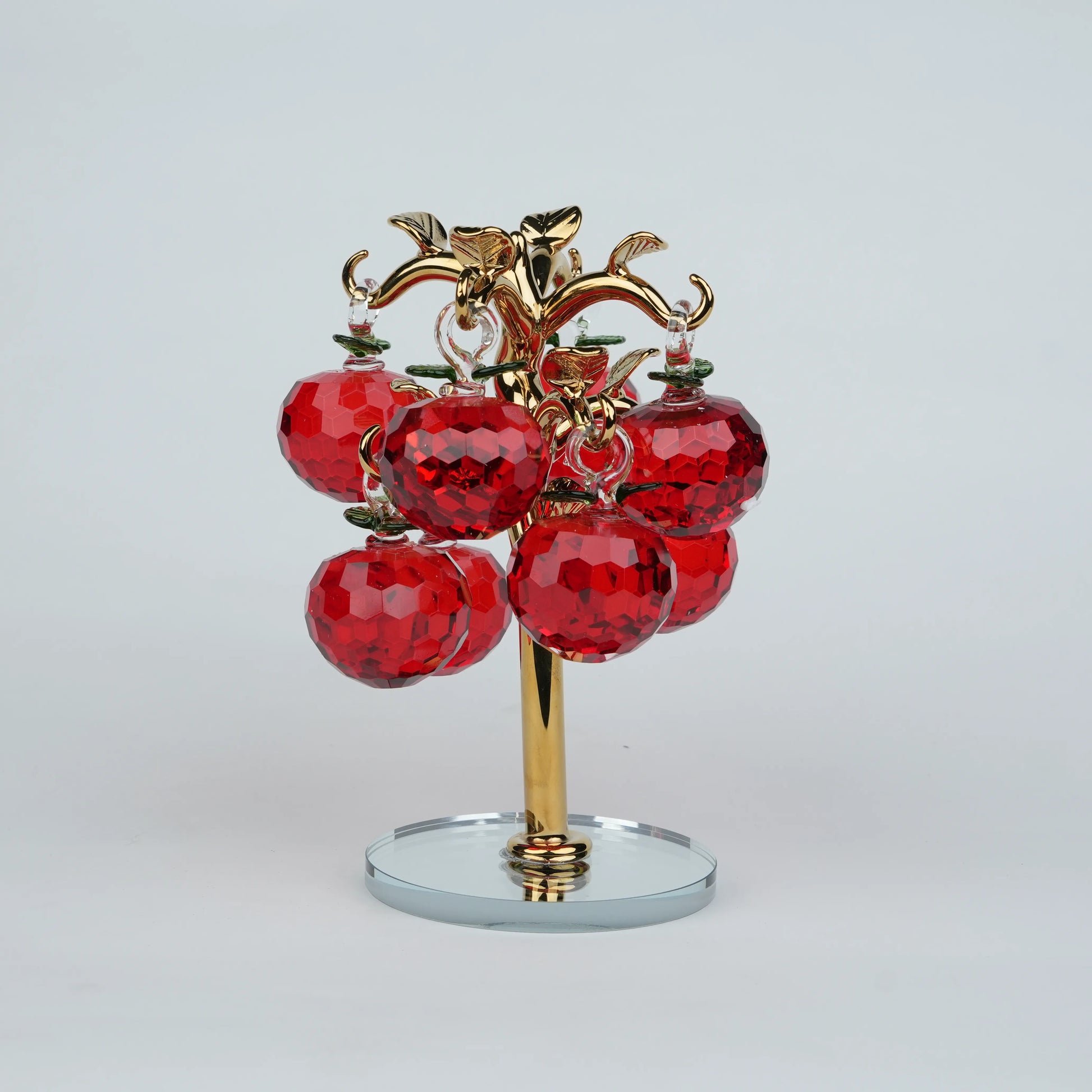 Large golden crystal apple tree décor with red faceted crystal apples on a mirrored base