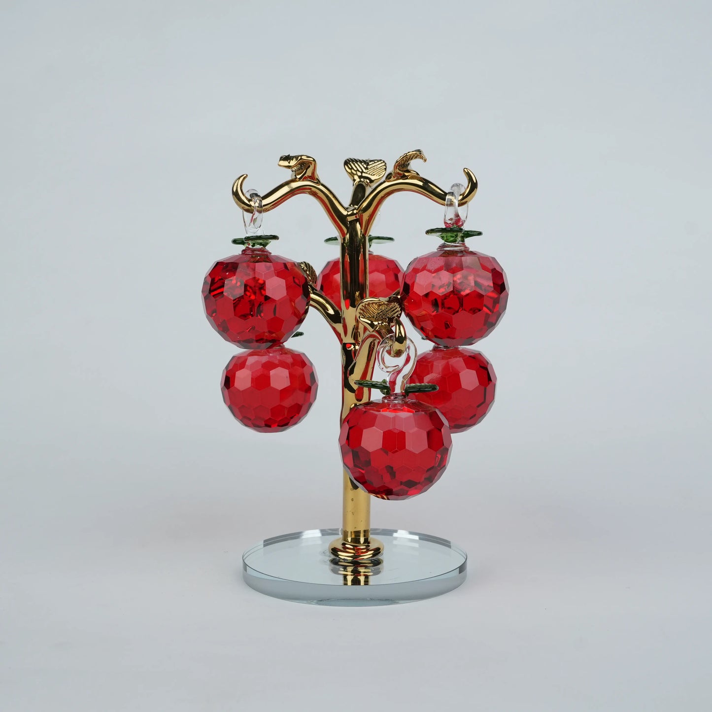 Large golden crystal apple tree décor with red faceted crystal apples on a mirrored base
