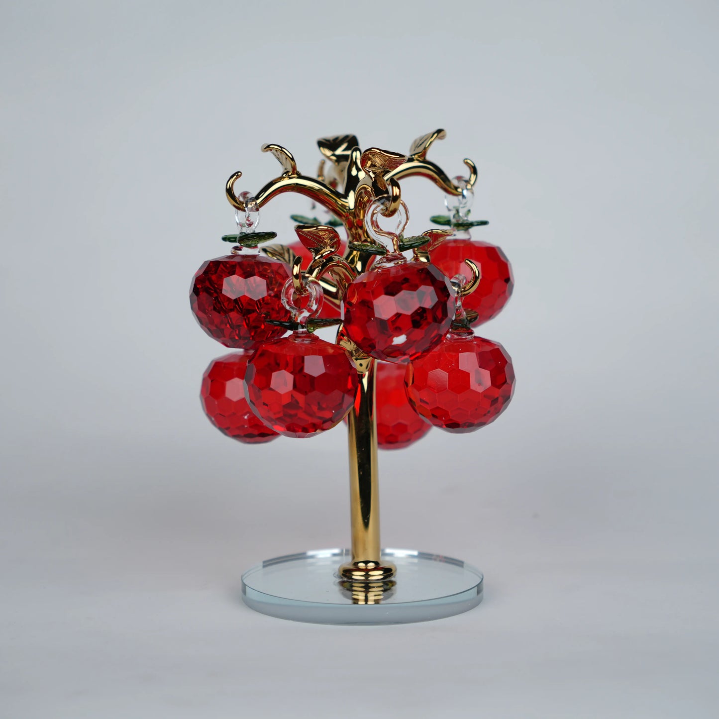 Large golden crystal apple tree décor with red faceted crystal apples on a mirrored base