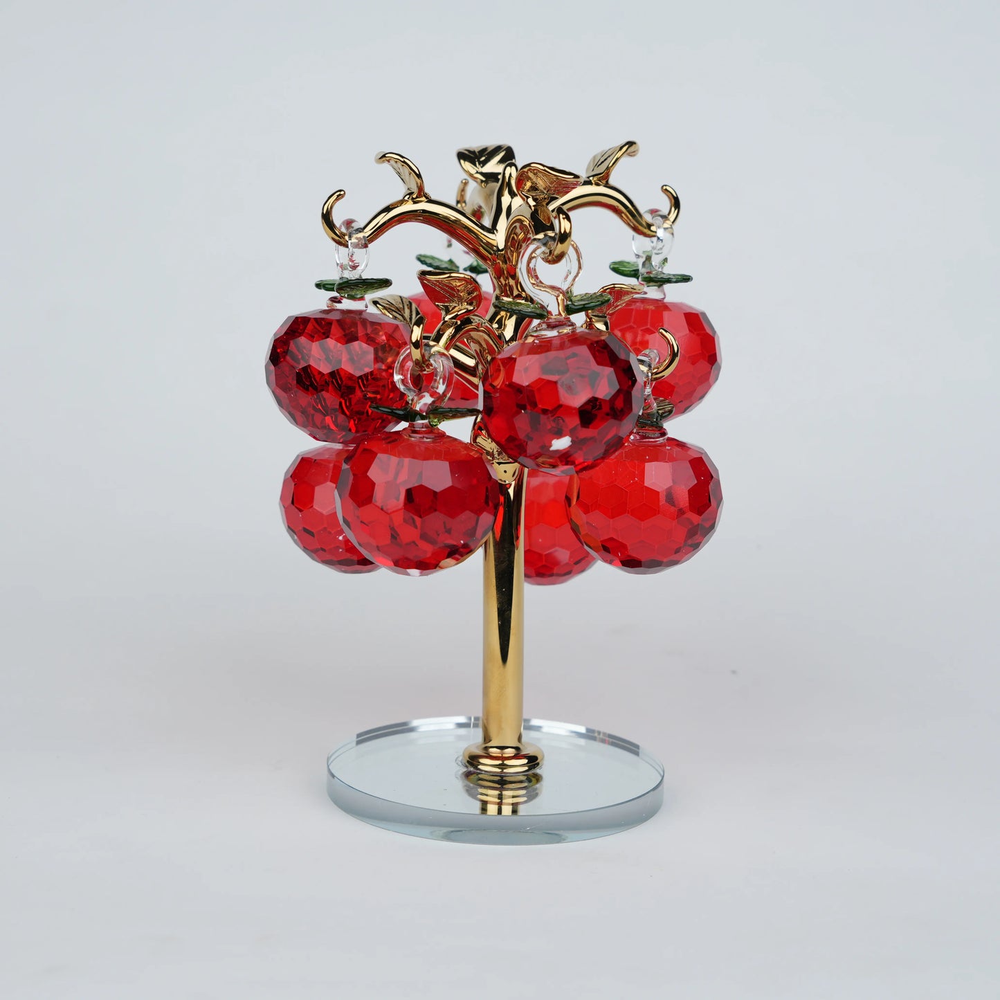 Large golden crystal apple tree décor with red faceted crystal apples on a mirrored base