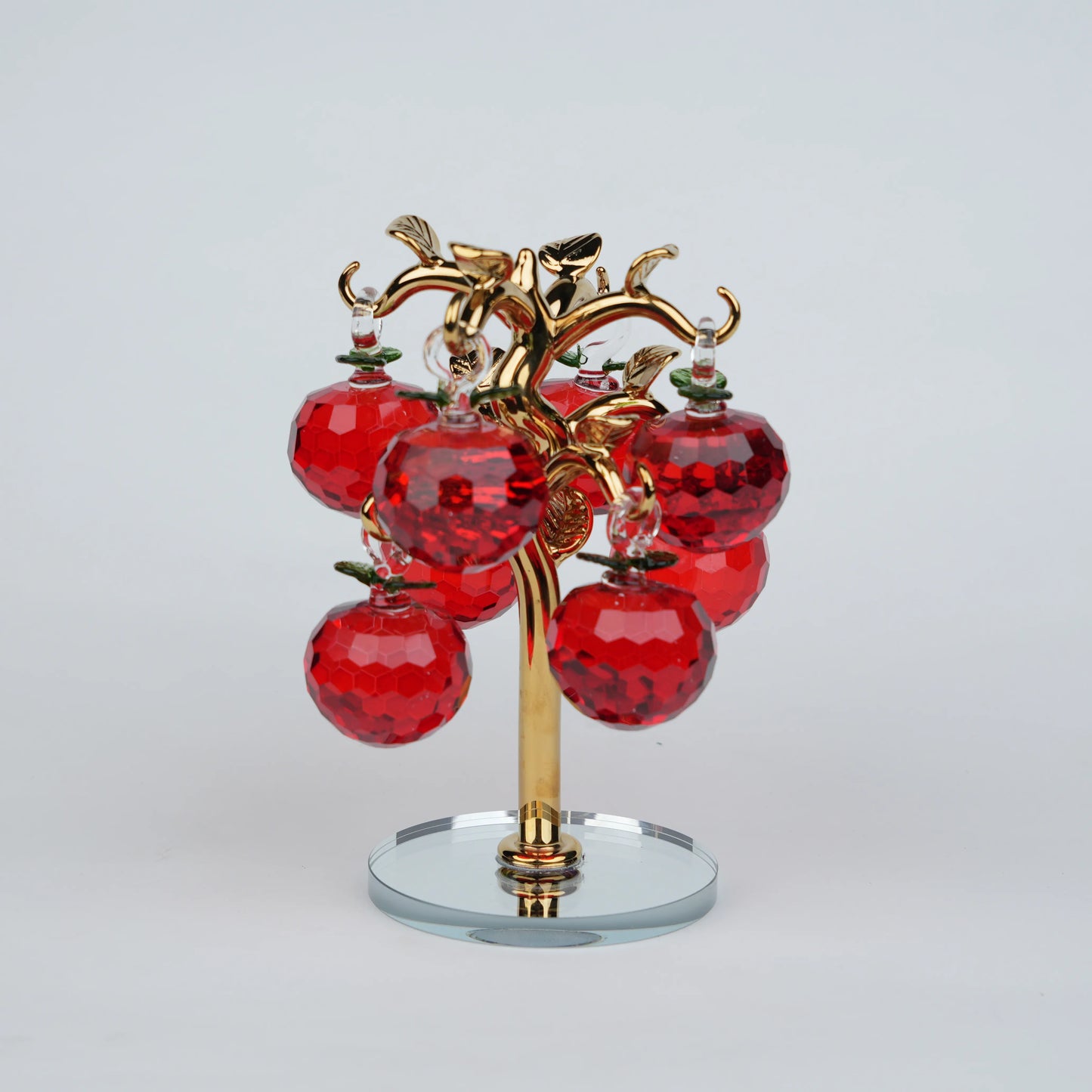 Large golden crystal apple tree décor with red faceted crystal apples on a mirrored base