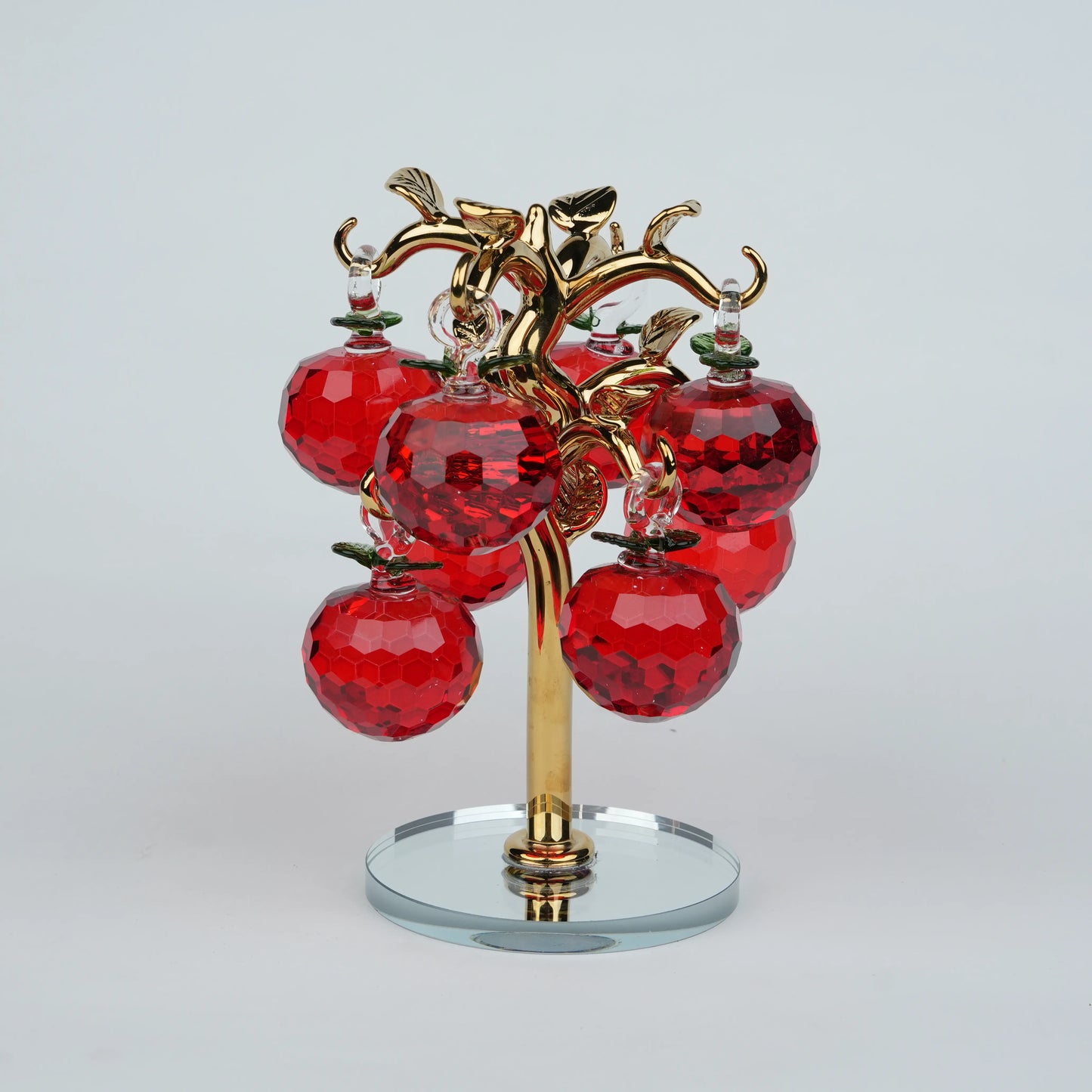 Large golden crystal apple tree décor with red faceted crystal apples on a mirrored base