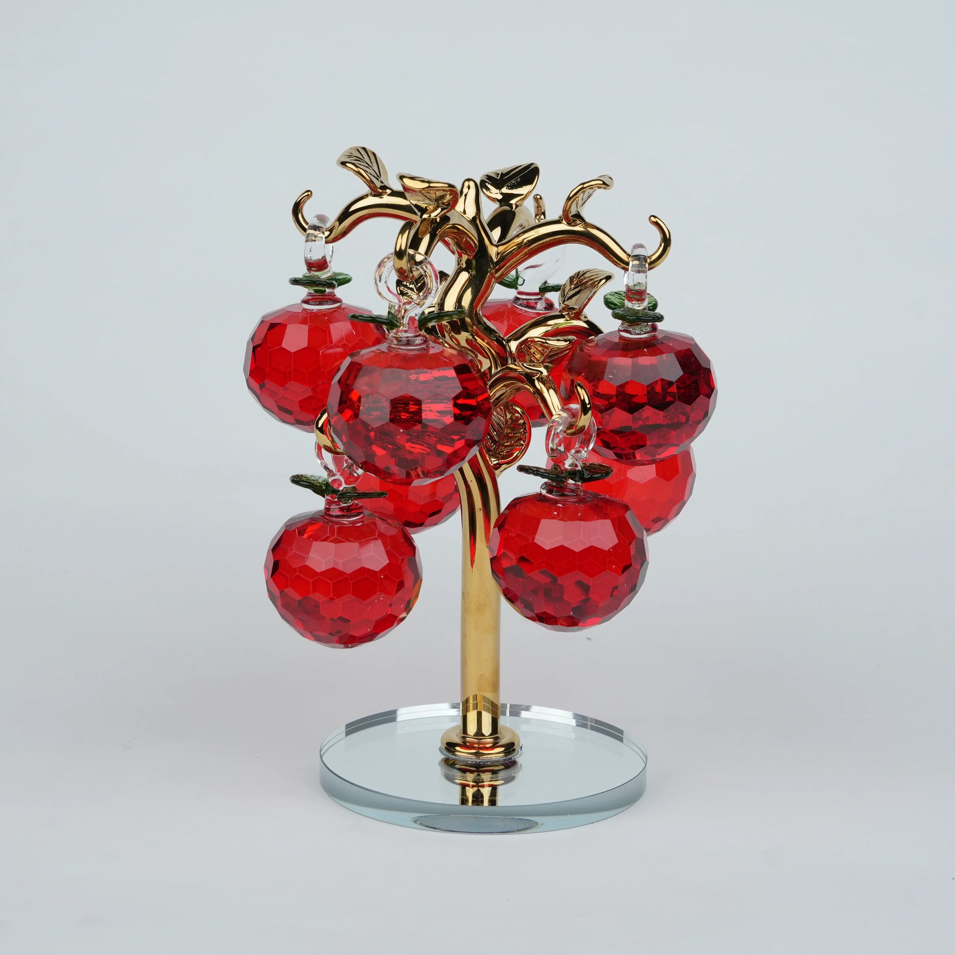 Large golden crystal apple tree décor with red faceted crystal apples on a mirrored base