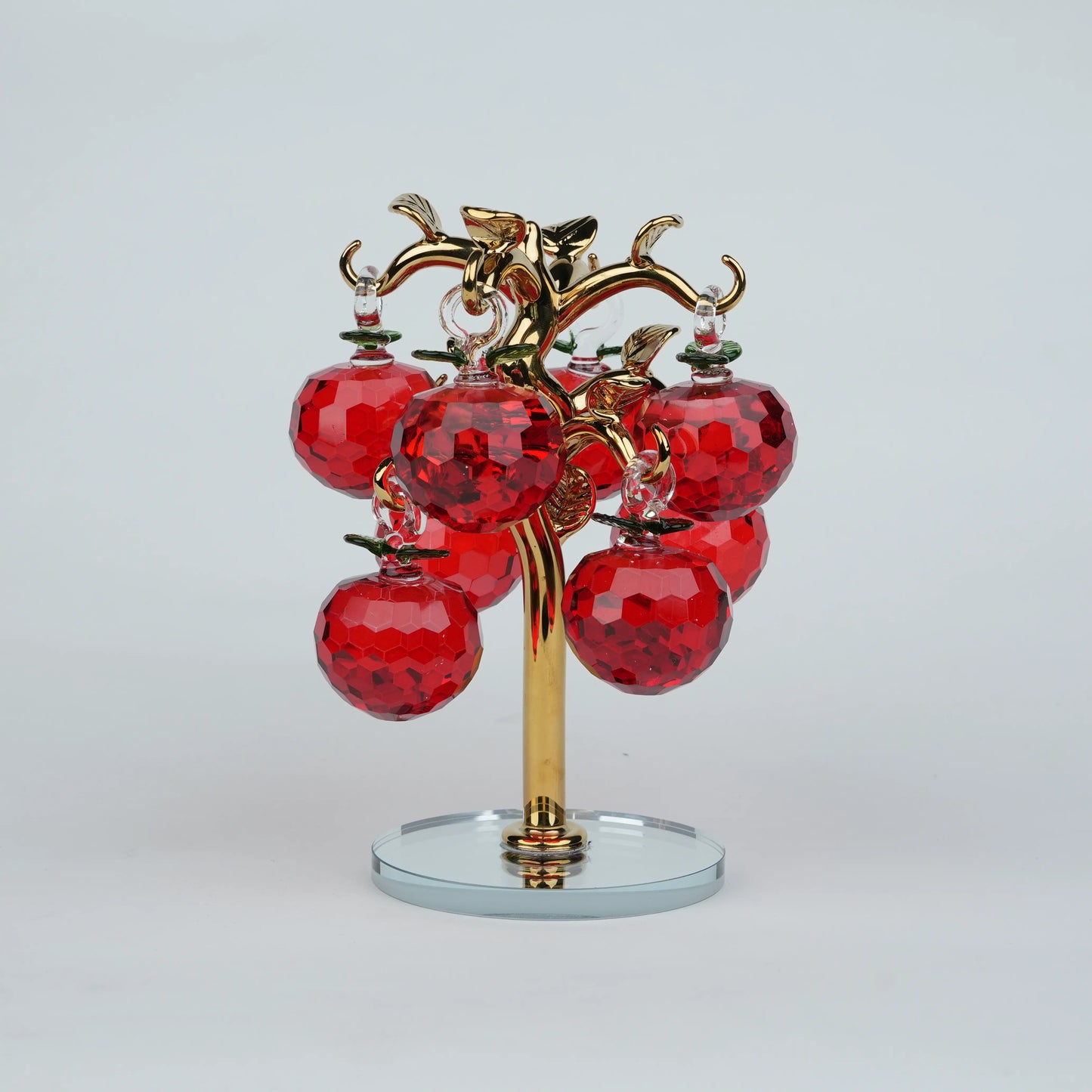 Large golden crystal apple tree décor with red faceted crystal apples on a mirrored base