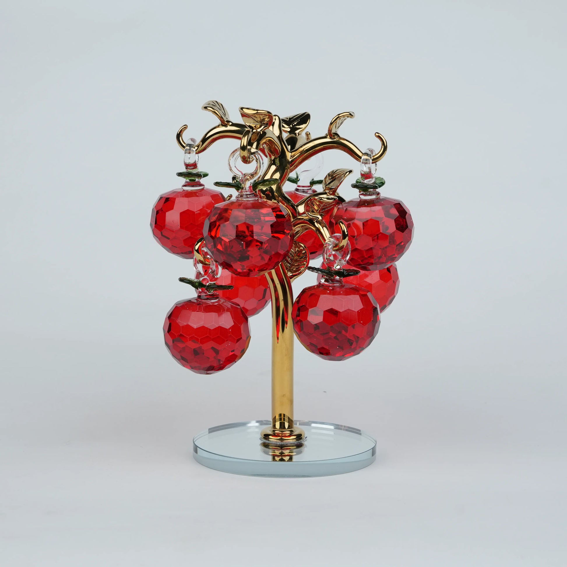 Large golden crystal apple tree décor with red faceted crystal apples on a mirrored base