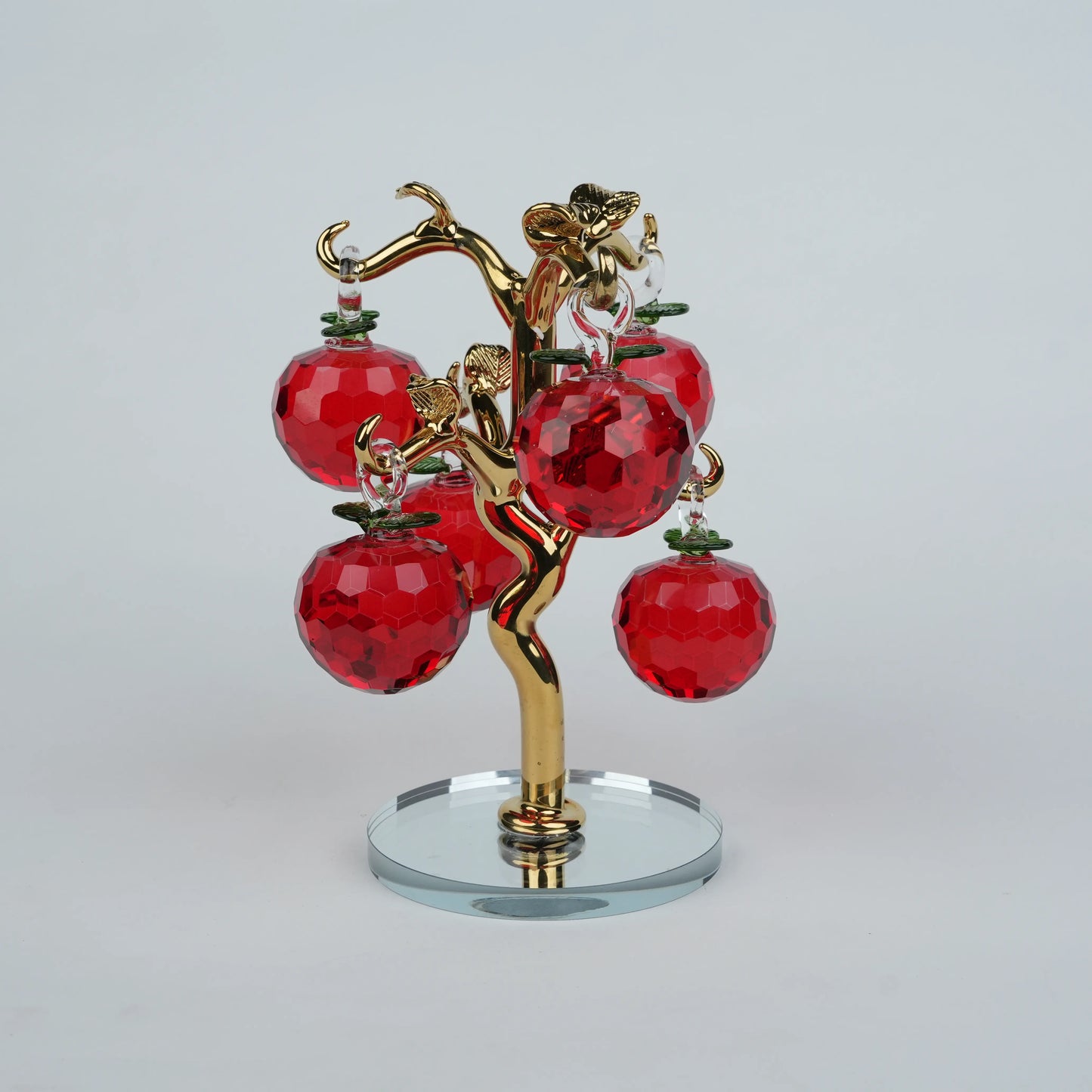 Red crystal apple tree showpiece with gold branches on a glass base
