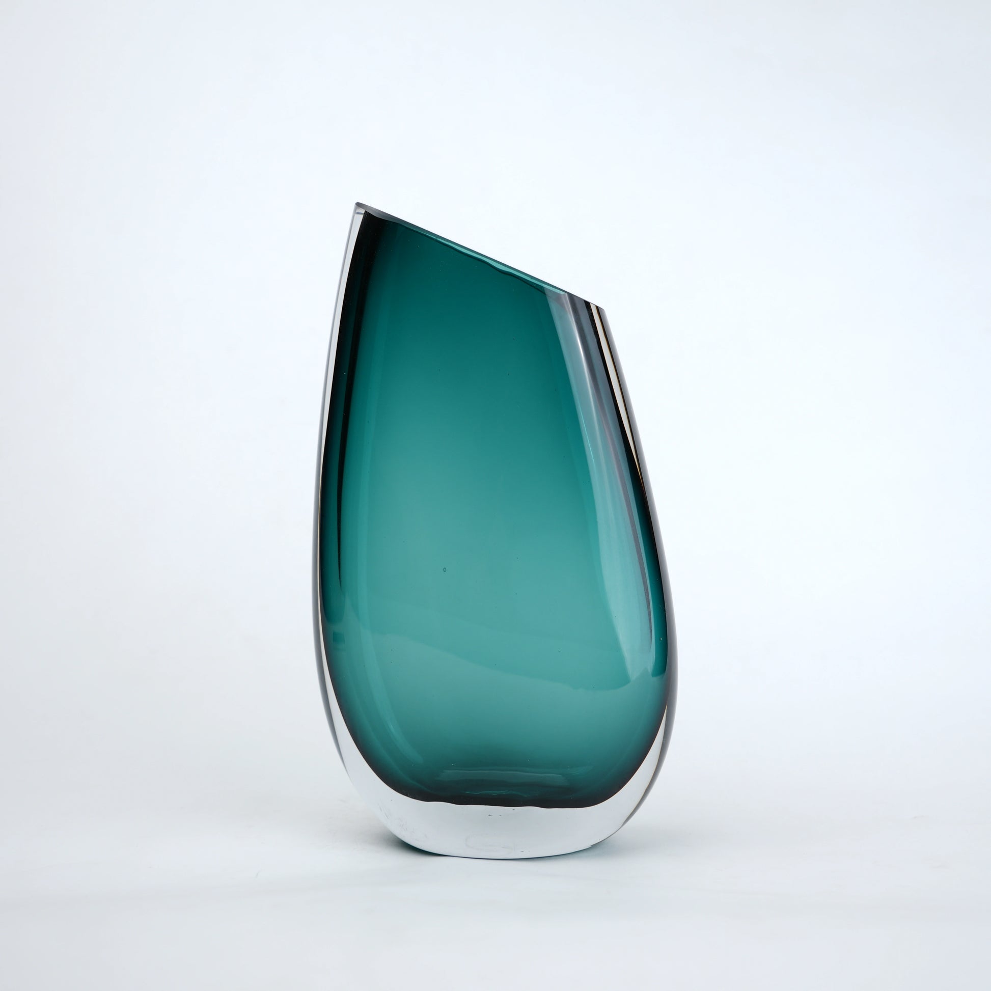 Deep teal curved glass vase with angled opening modern decor