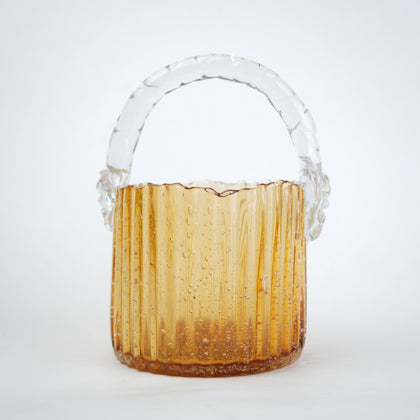 Amber ribbed glass basket with clear handle decorative design