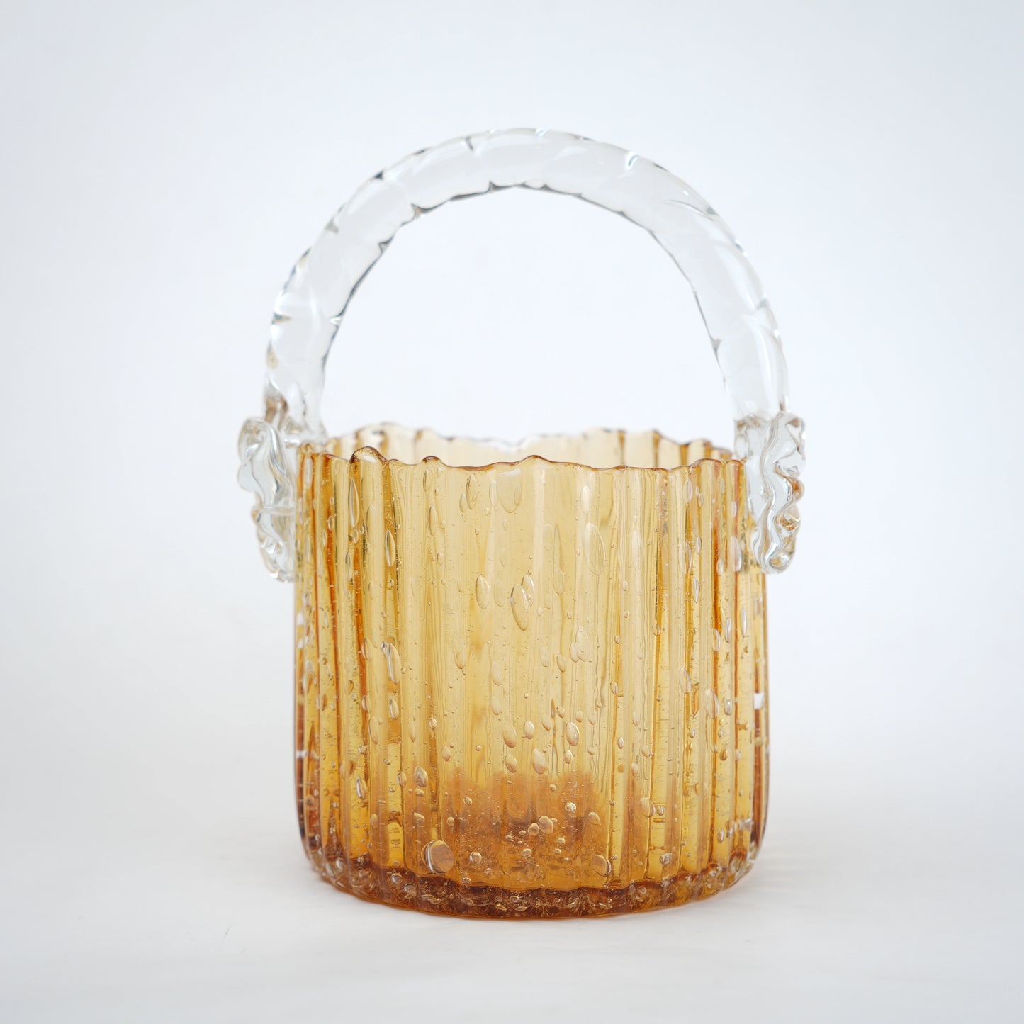 Amber ribbed glass basket with clear handle decorative design