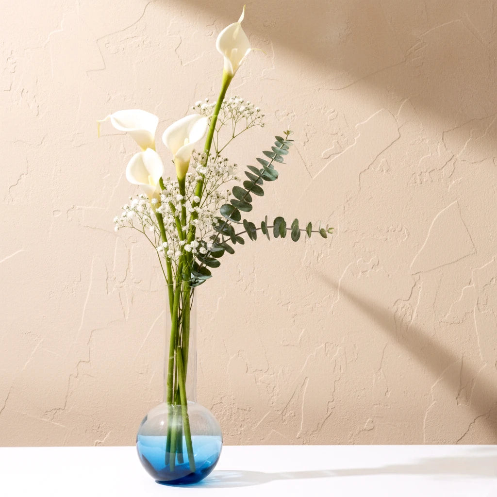 Glass vase with spherical base and elongated cylindrical neck designed for single stem floral arrangements