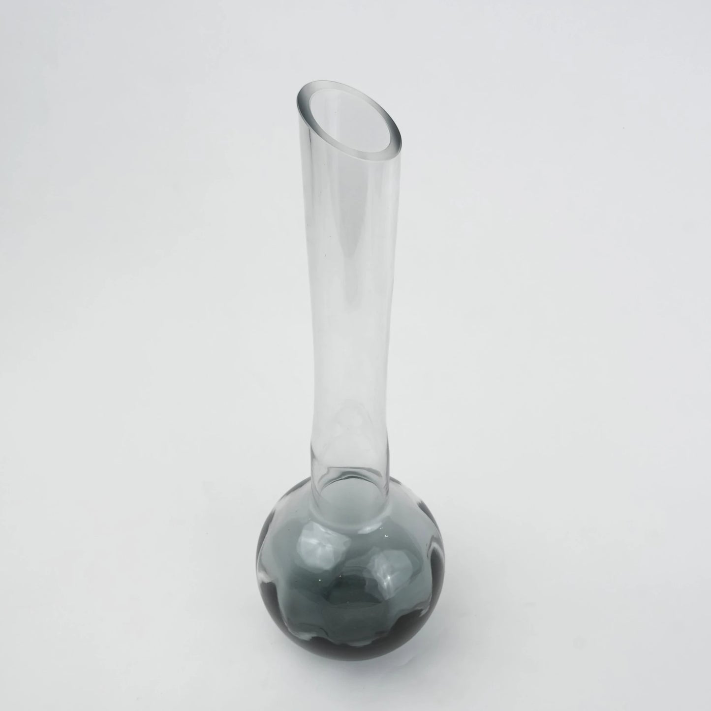 Glass vase with spherical base and elongated cylindrical neck designed for single stem floral arrangements