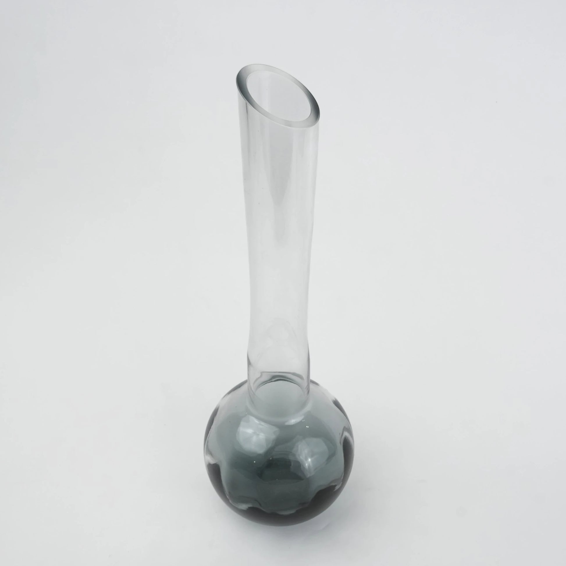 Glass vase with spherical base and elongated cylindrical neck designed for single stem floral arrangements