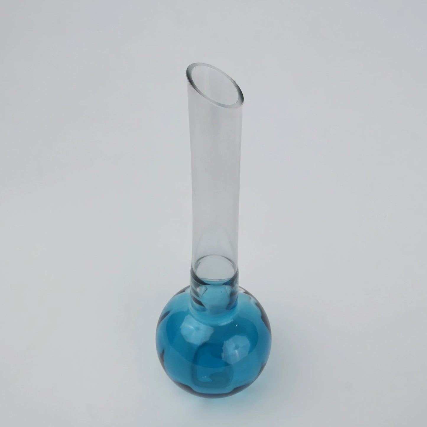 Glass vase with spherical base and elongated cylindrical neck designed for single stem floral arrangements