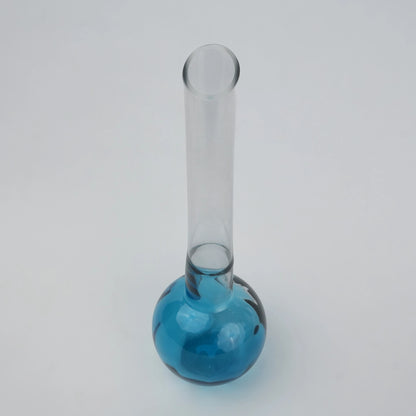 Glass vase with spherical base and elongated cylindrical neck designed for single stem floral arrangements