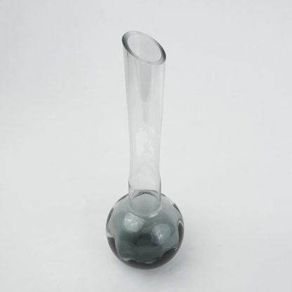Glass vase with spherical base and elongated cylindrical neck designed for single stem floral arrangements