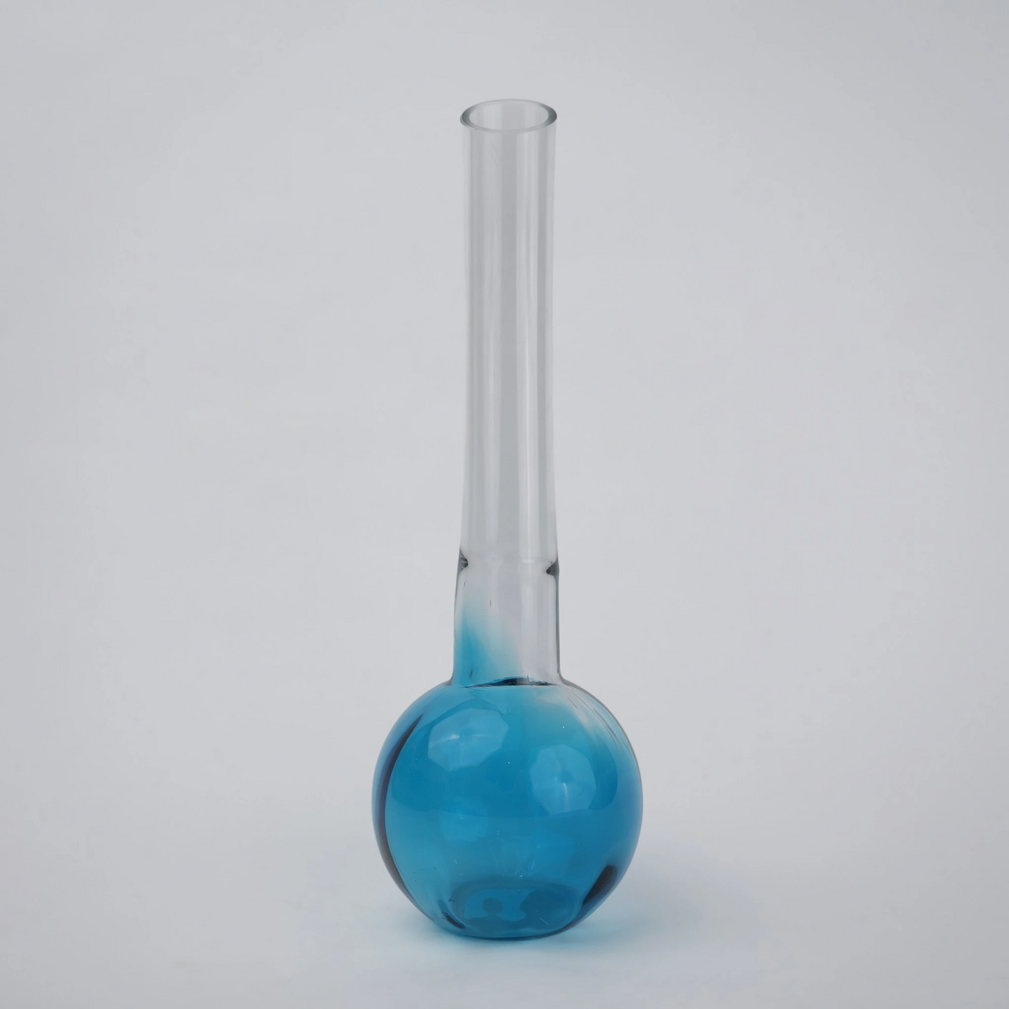 Glass vase with spherical base and elongated cylindrical neck designed for single stem floral arrangements