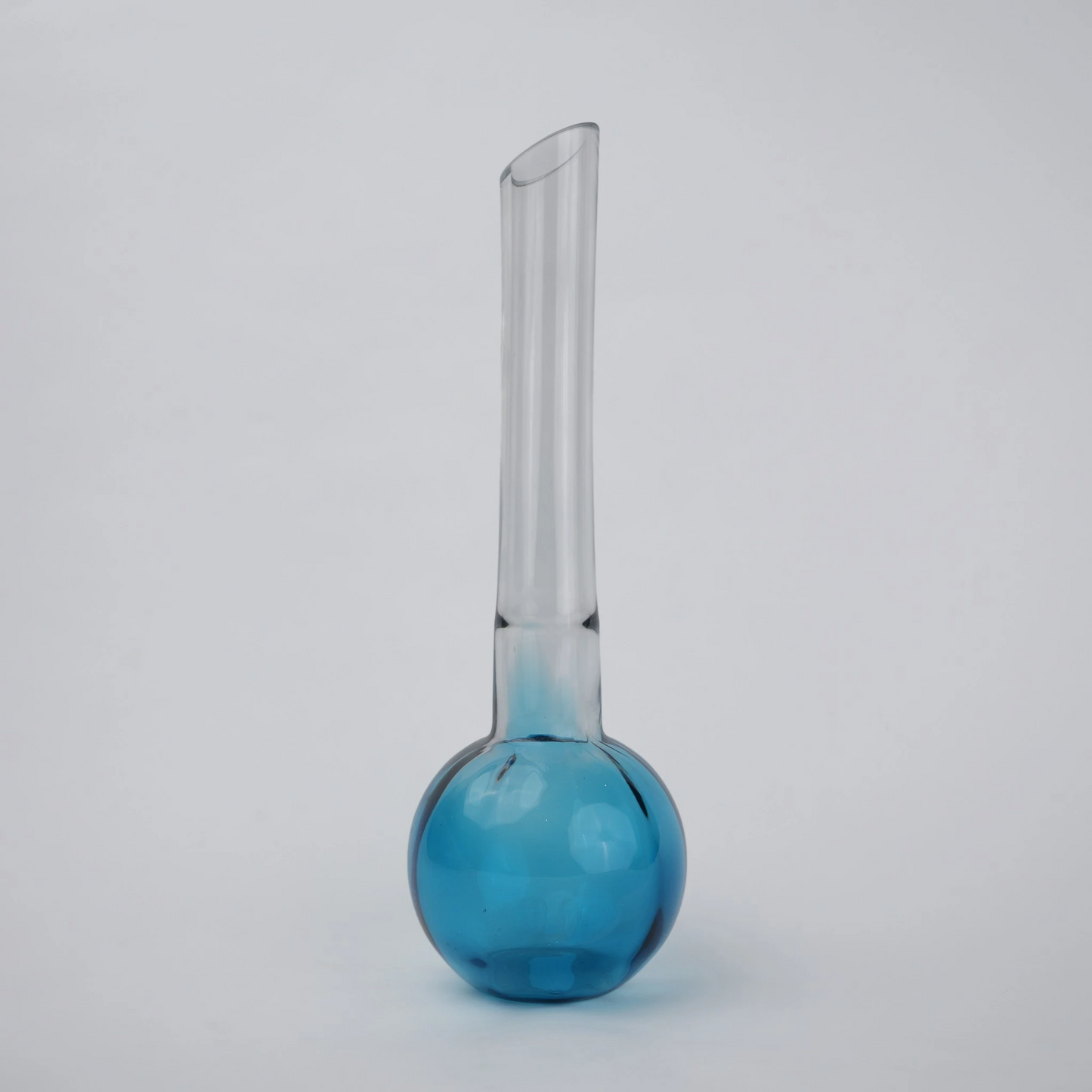 Glass vase with spherical base and elongated cylindrical neck designed for single stem floral arrangements