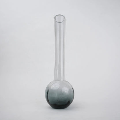 Glass vase with spherical base and elongated cylindrical neck designed for single stem floral arrangements