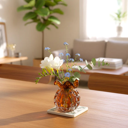 Sculptural amber-toned art glass vase with textured molten-inspired silhouette.