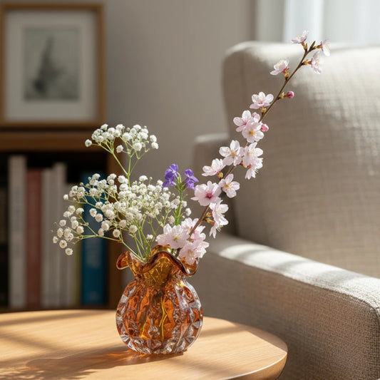 Sculptural amber-toned art glass vase with textured molten-inspired silhouette.