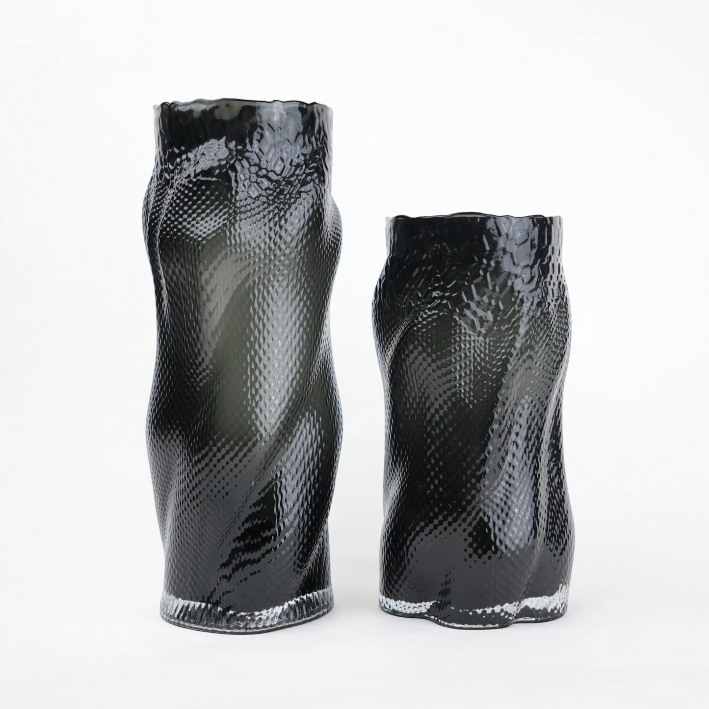 Textured art glass vase with flowing sculptural form and dimensional surface detailing