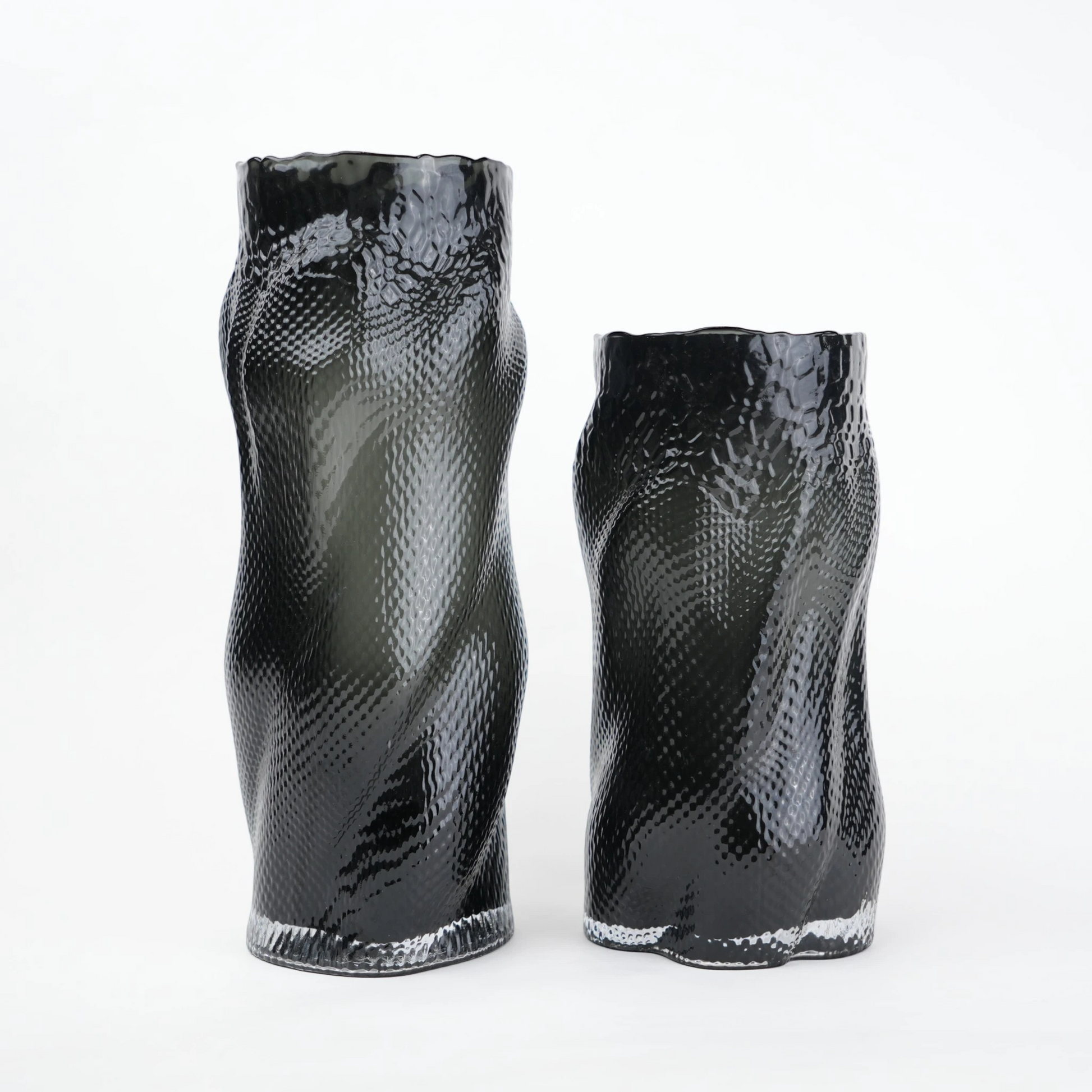 Textured art glass vase with flowing sculptural form and dimensional surface detailing