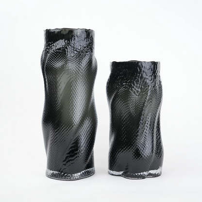 Textured art glass vase with flowing sculptural form and dimensional surface detailing