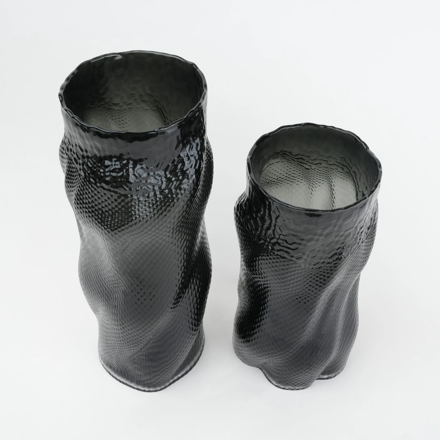 Textured art glass vase with flowing sculptural form and dimensional surface detailing