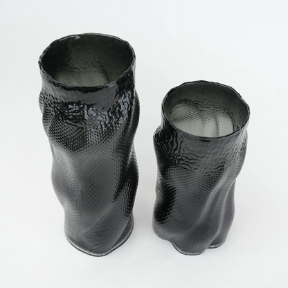 Textured art glass vase with flowing sculptural form and dimensional surface detailing