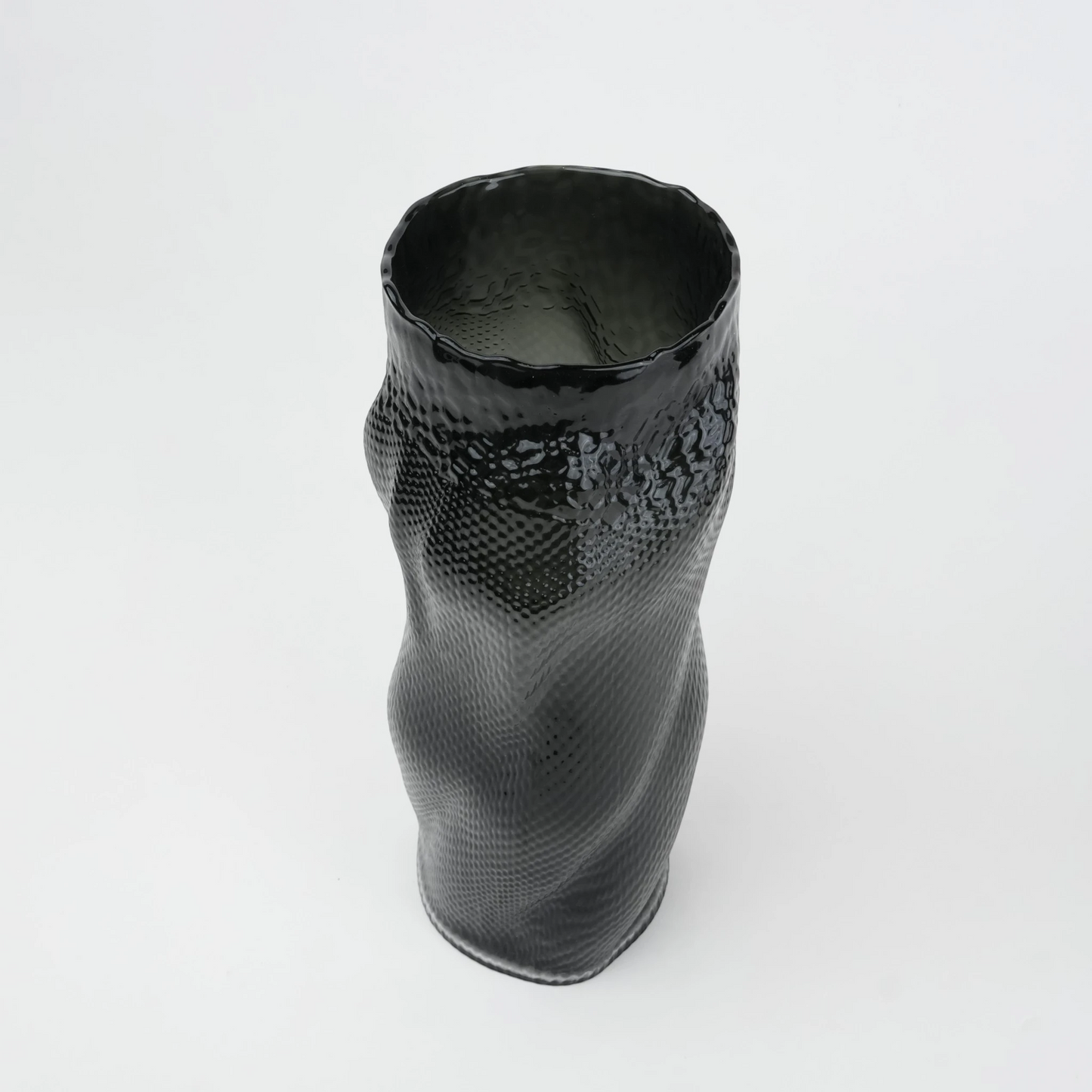 Textured art glass vase with flowing sculptural form and dimensional surface detailing