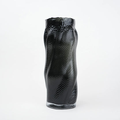 Textured art glass vase with flowing sculptural form and dimensional surface detailing