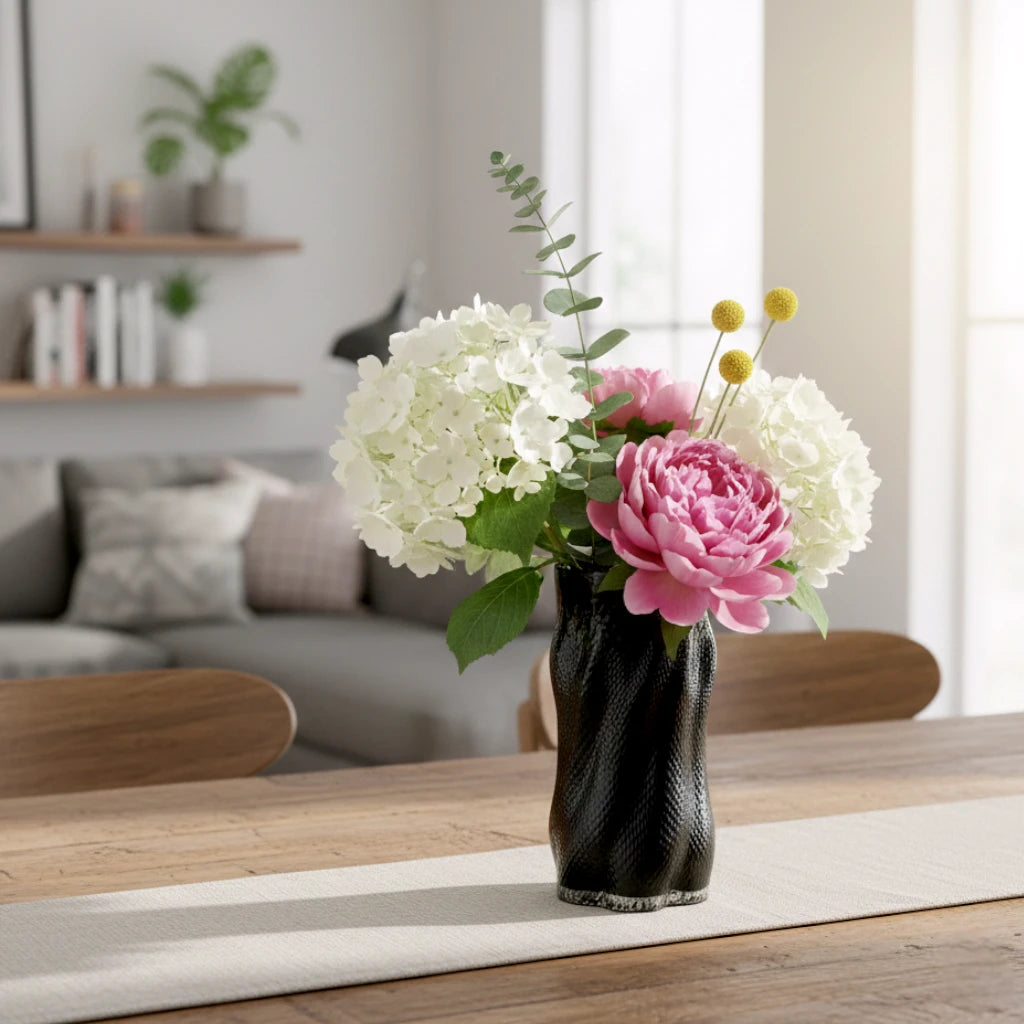 Textured art glass vase with flowing sculptural form and dimensional surface detailing
