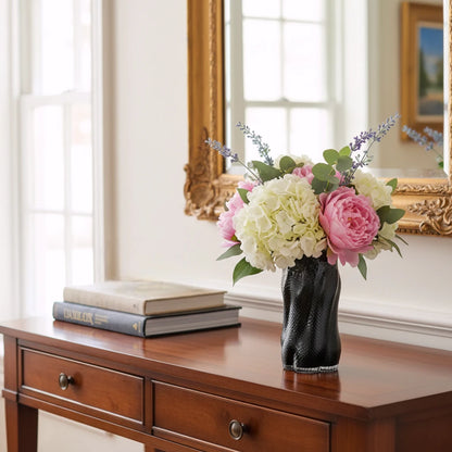 Textured art glass vase with flowing sculptural form and dimensional surface detailing