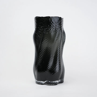 Textured art glass vase with flowing sculptural form and dimensional surface detailing