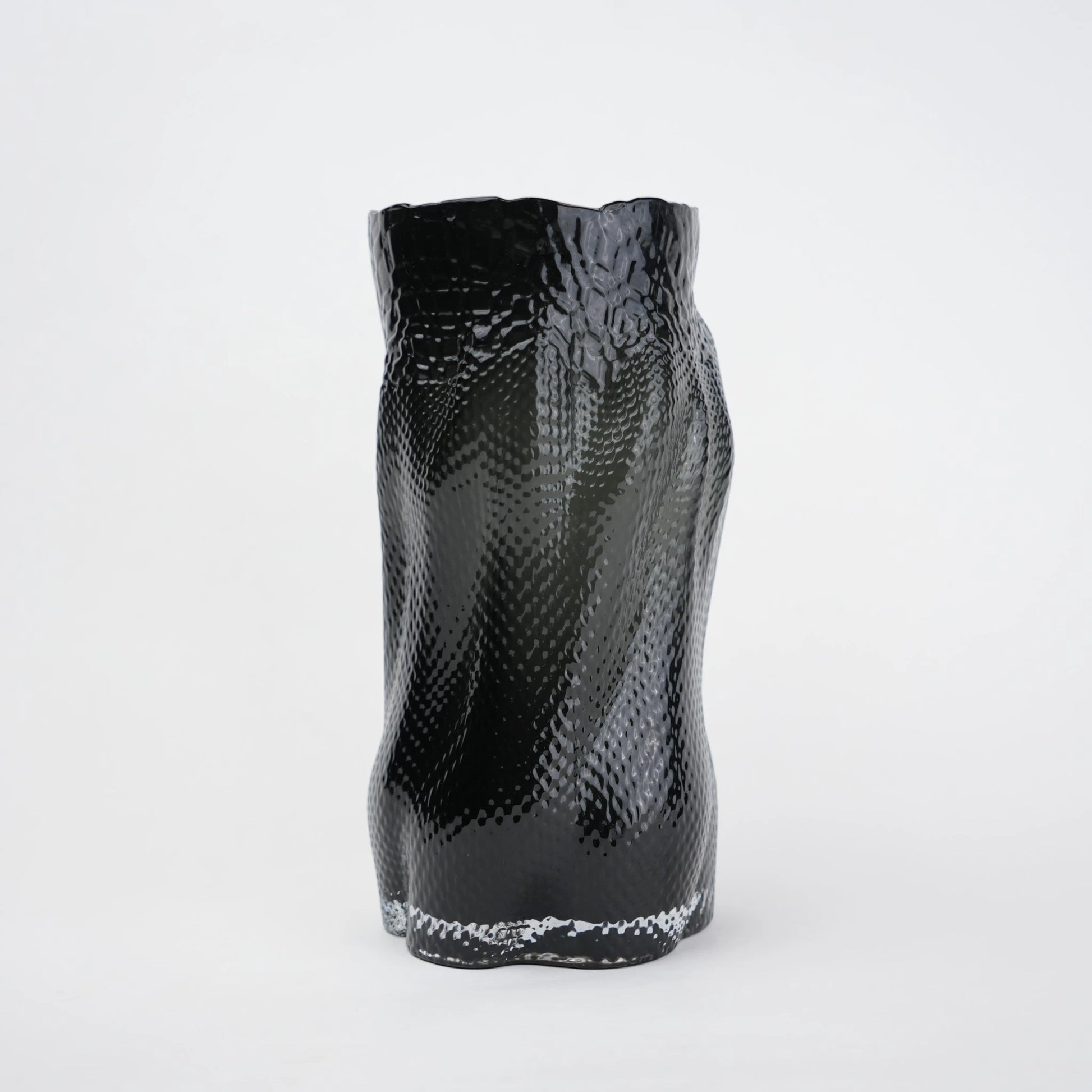 Textured art glass vase with flowing sculptural form and dimensional surface detailing