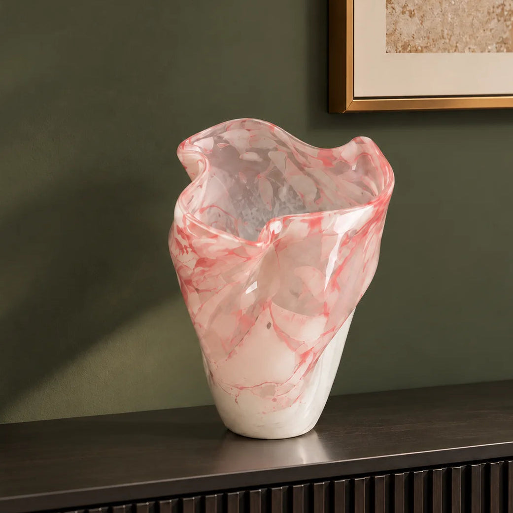 Frosted white glass vase with soft blush marble veining and smooth tapered silhouette.