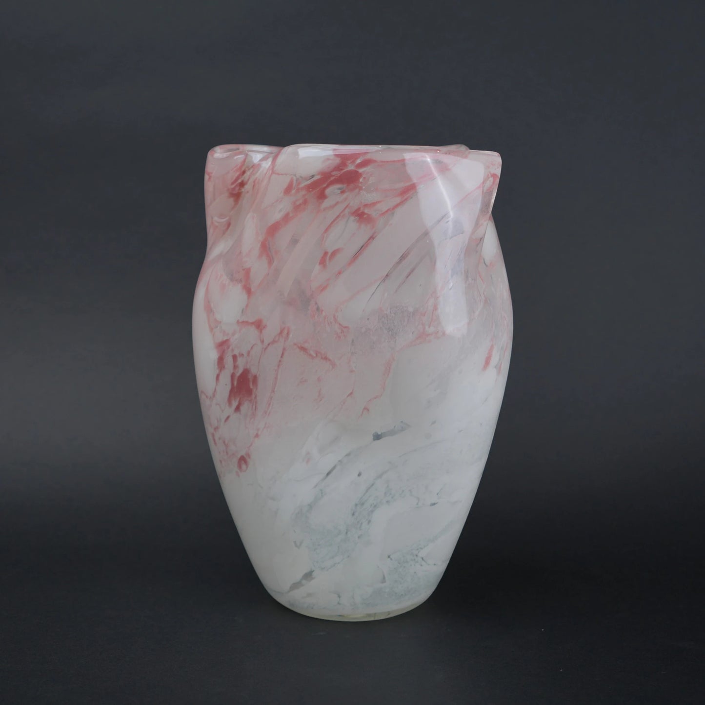 Frosted white glass vase with soft blush marble veining and smooth tapered silhouette.