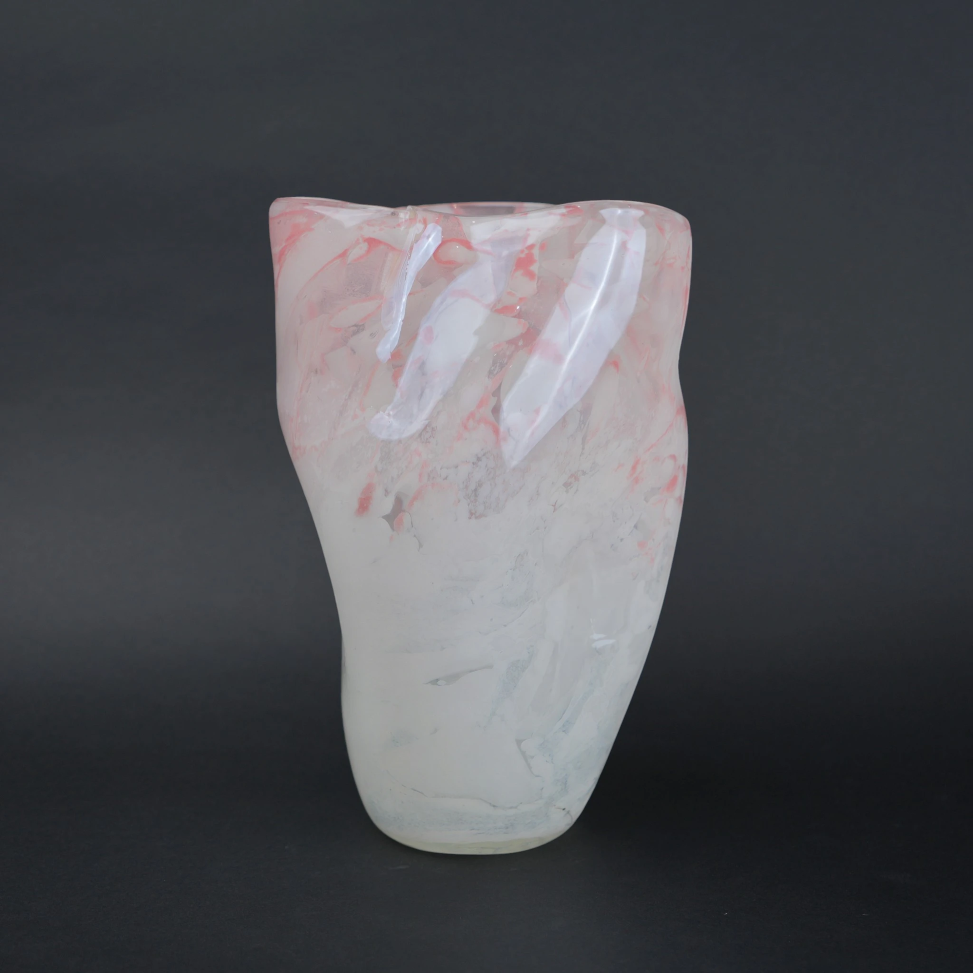 Frosted white glass vase with soft blush marble veining and smooth tapered silhouette.