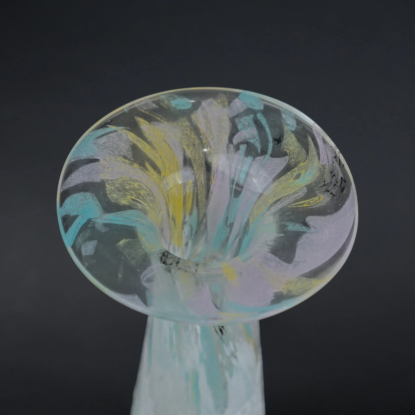 Tall frosted white glass vase with elongated tapered body and flared iridescent rim.