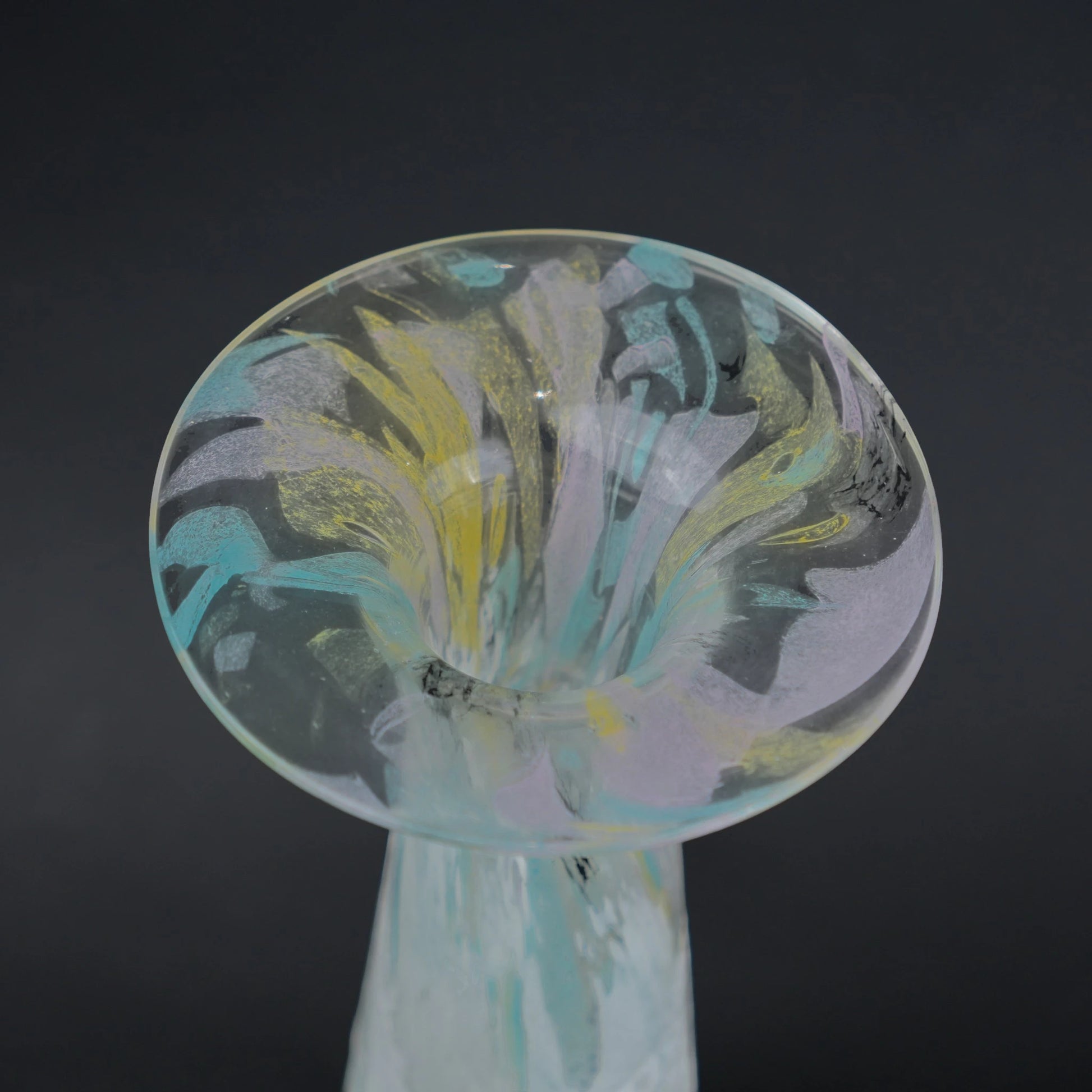 Tall frosted white glass vase with elongated tapered body and flared iridescent rim.