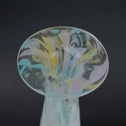Tall frosted white glass vase with elongated tapered body and flared iridescent rim.