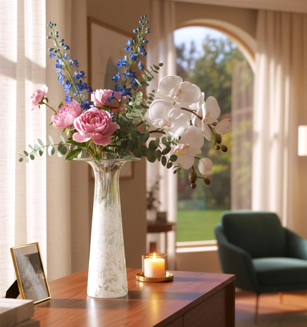 Tall frosted white glass vase with elongated tapered body and flared iridescent rim.