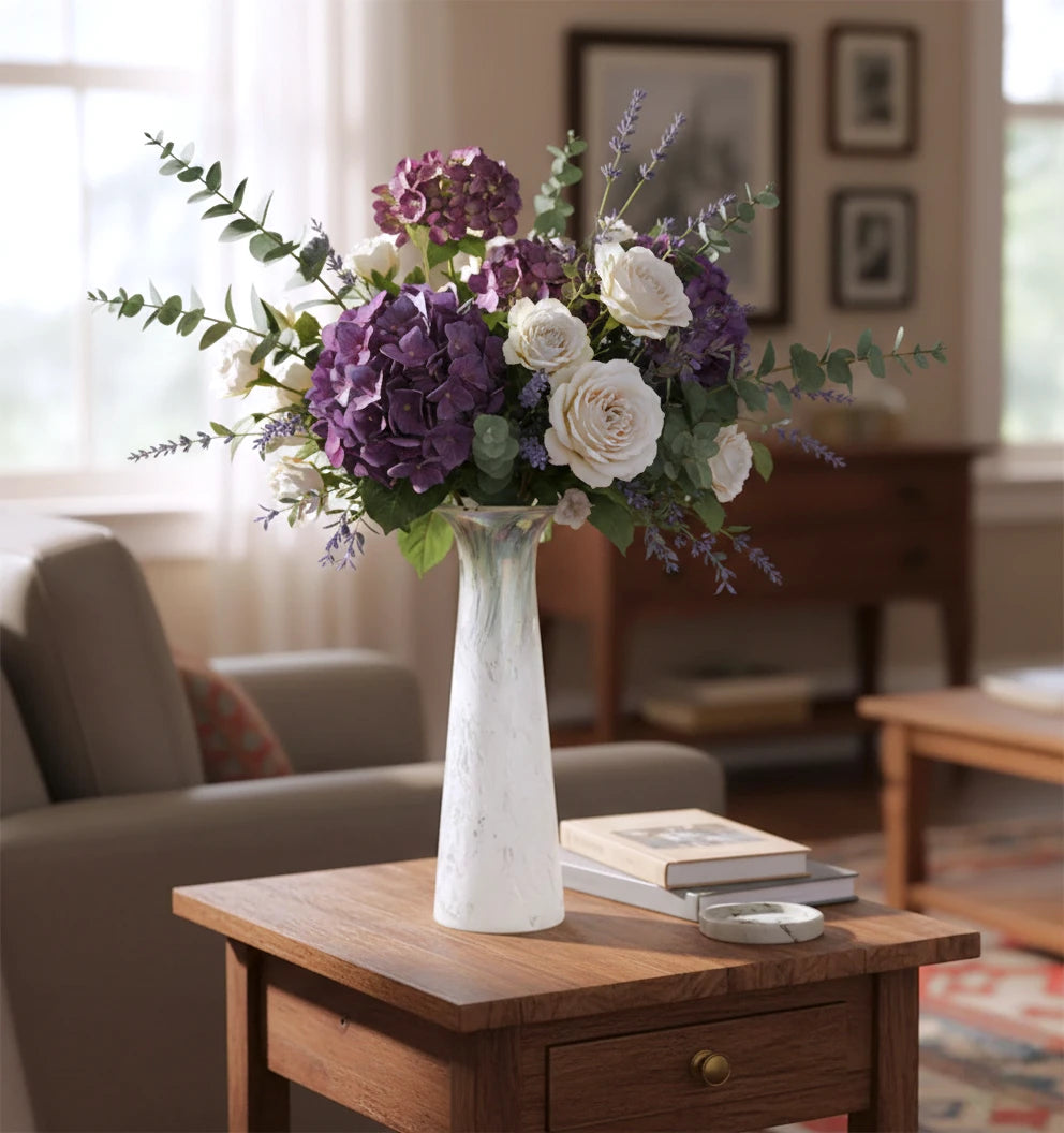 Tall frosted white glass vase with elongated tapered body and flared iridescent rim.