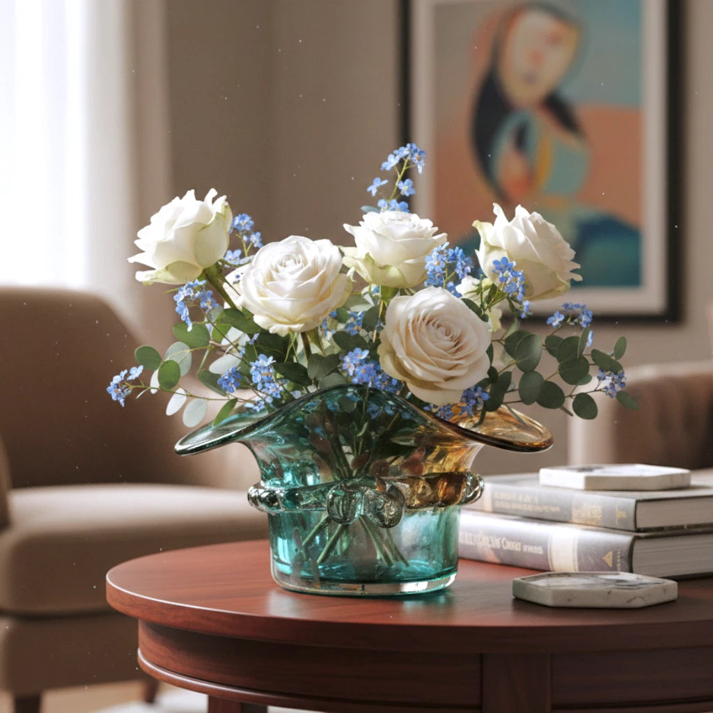 Dual-tone aqua and amber glass vase with sculptural wave-shaped rim and rounded base.