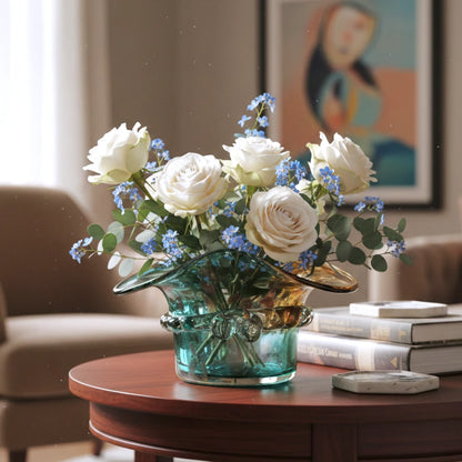 Dual-tone aqua and amber glass vase with sculptural wave-shaped rim and rounded base.